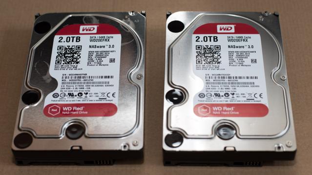 Two red WD hard disk drives.
